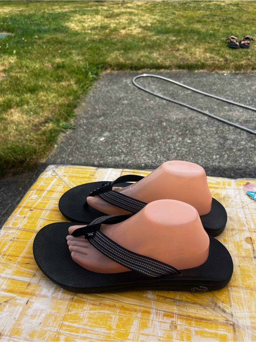 Chaco Black Flip Sandals with Striped Webbing